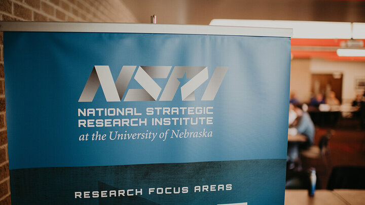 An NSRI banner hangs at an event sponsored by the research group