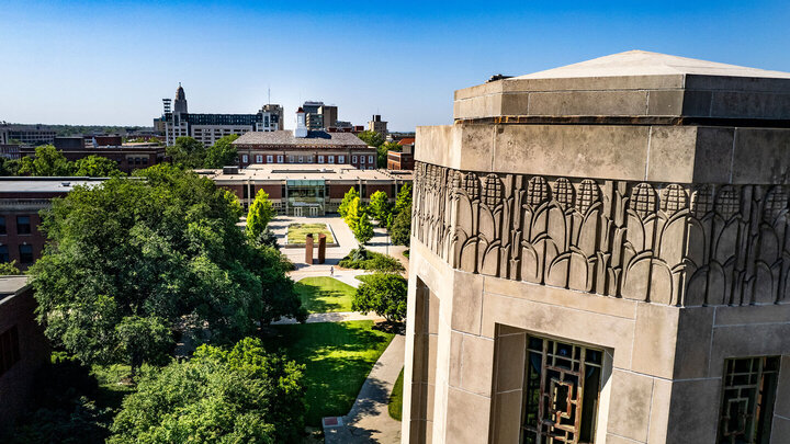 Arial view of campus bell tower and library. 