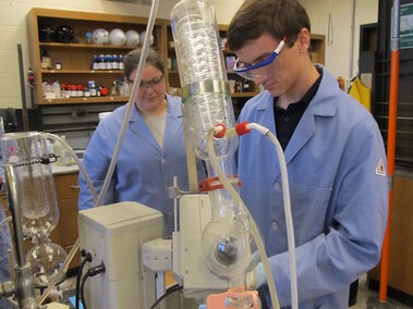 High school interns conducting research in a lab